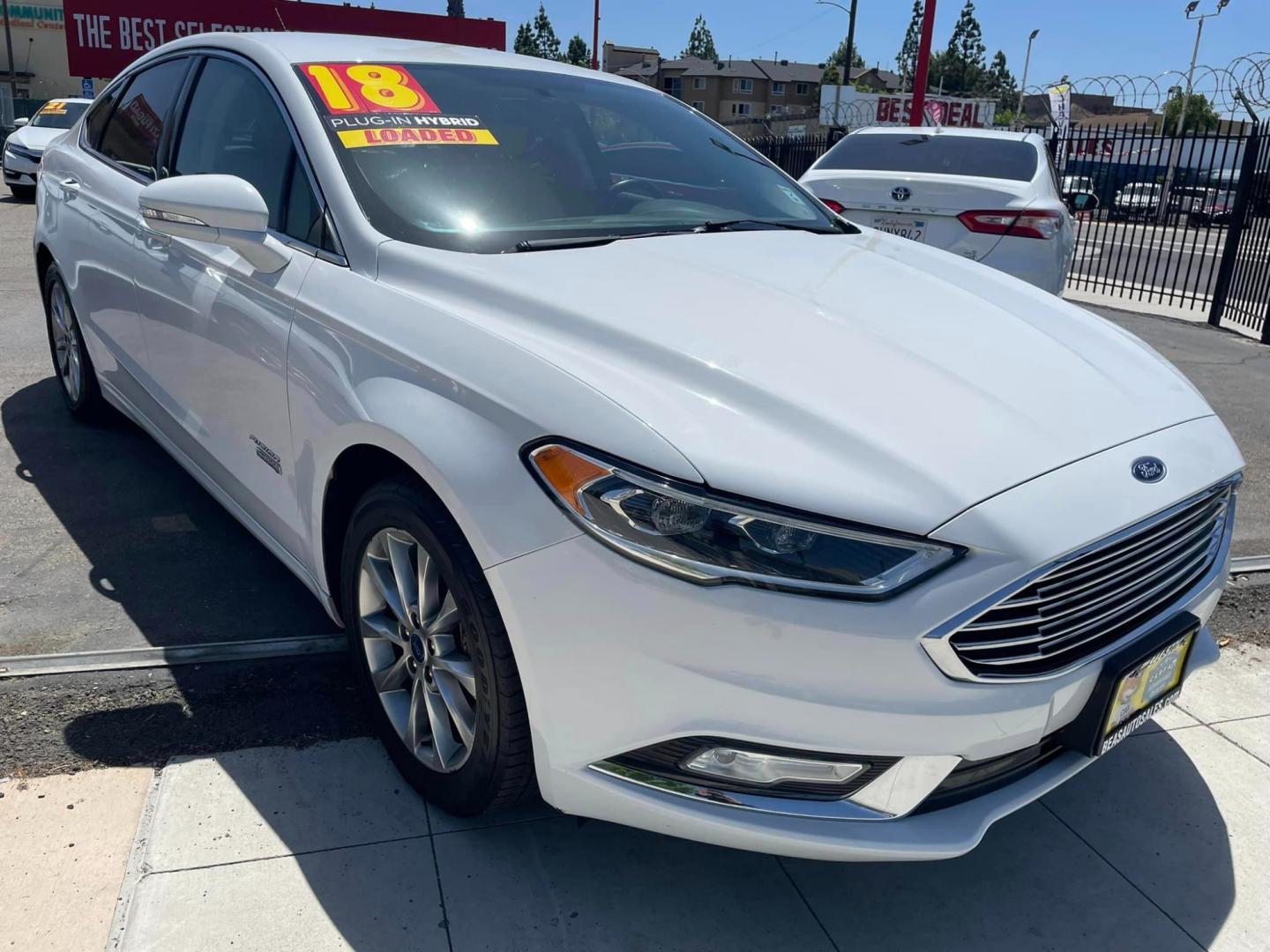 2018 WHITE /BLACK Ford Fusion Energi Titanium (3FA6P0SU6JR) with an 2.0L L4 DOHC 16V HYBRID engine, CVT transmission, located at 744 E Miner Ave, Stockton, CA, 95202, (209) 944-5770, 37.956863, -121.282082 - PLUS TAXES AND FEES - Photo#0